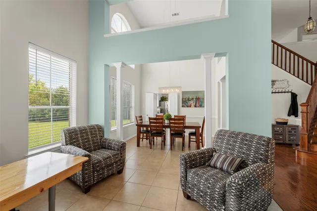 a view of staircase with wooden floor and a window