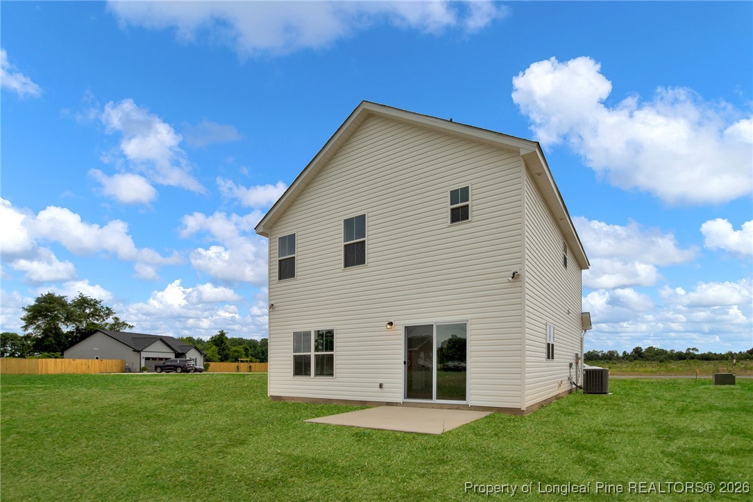 253 Barberry Road Raeford, NC 28376 - Photo 26 of 31 a view of a house with a backyard