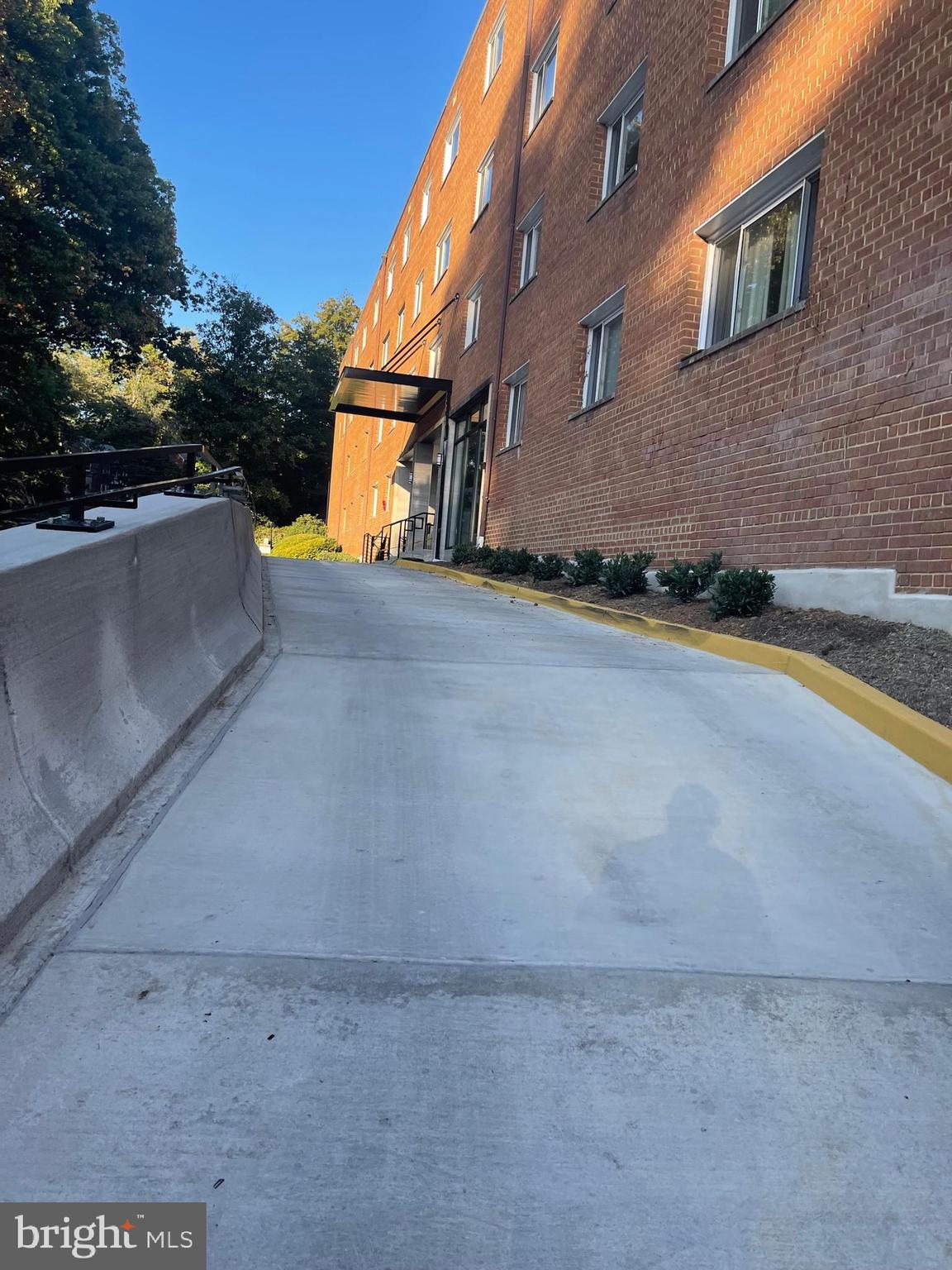 95 East Wayne Avenue, Unit 204 Silver Spring, MD 20901 - Photo 2 of 16 Front drive wayt to lobby