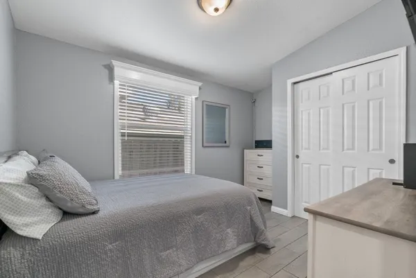 a bedroom with a bed and a cabinets