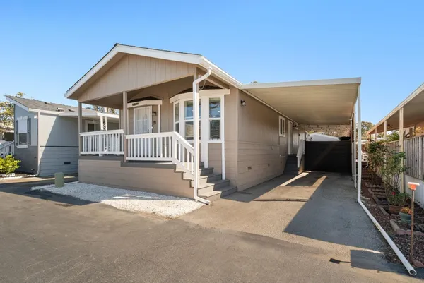 a front view of a house with garage