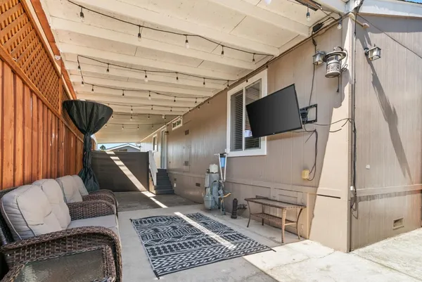 a view of a backyard with sitting area
