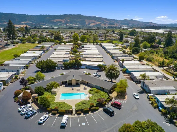 an aerial view of residential houses with outdoor space