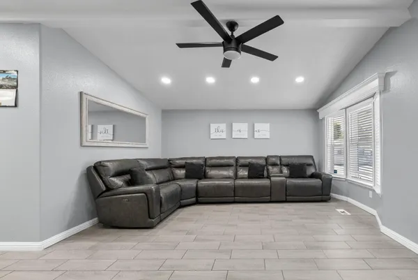 a living room with furniture and a window