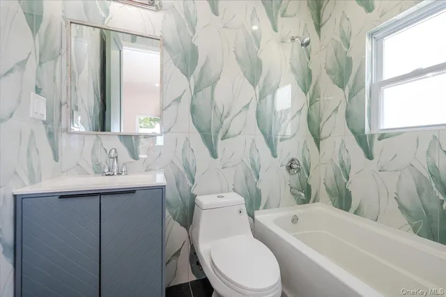 a bathroom with a sink a toilet and a bathtub