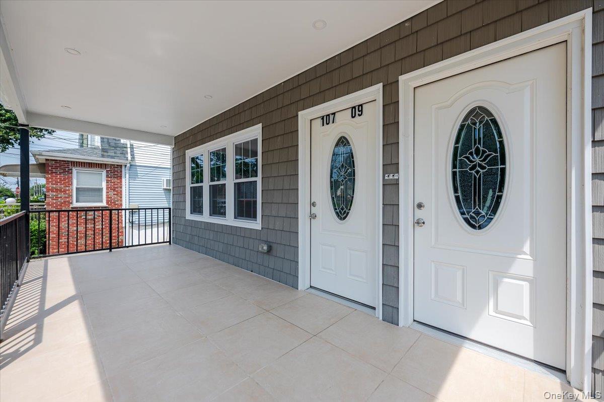 10709 220th Street Queens, NY 11429 - Photo 2 of 14 a view of a house with entryway and front door