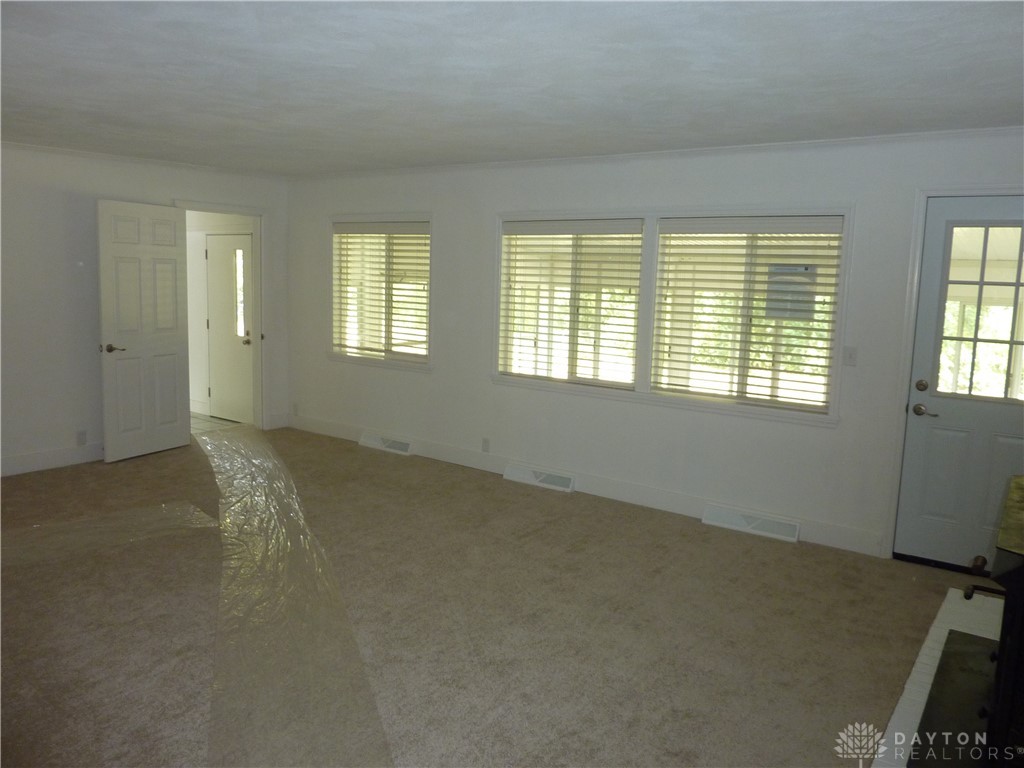 729 Brookfield Road Kettering, OH 45429 - Photo 7 of 30 Living room leading out to Florida room.