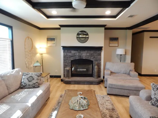a kitchen with a sink and wooden floor