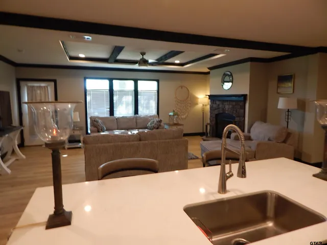 a kitchen with sink and refrigerator