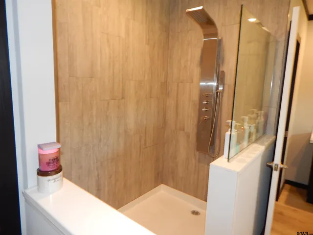 a white bath tub sitting next to a white sink