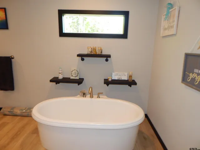 a bathroom with a sink double vanity and a mirror