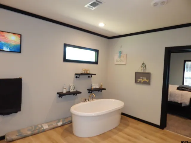 a view of kitchen with furniture and wooden floor