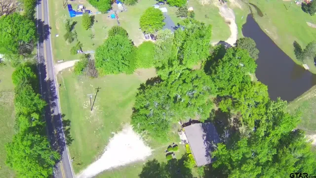 a view of a lake with a big yard