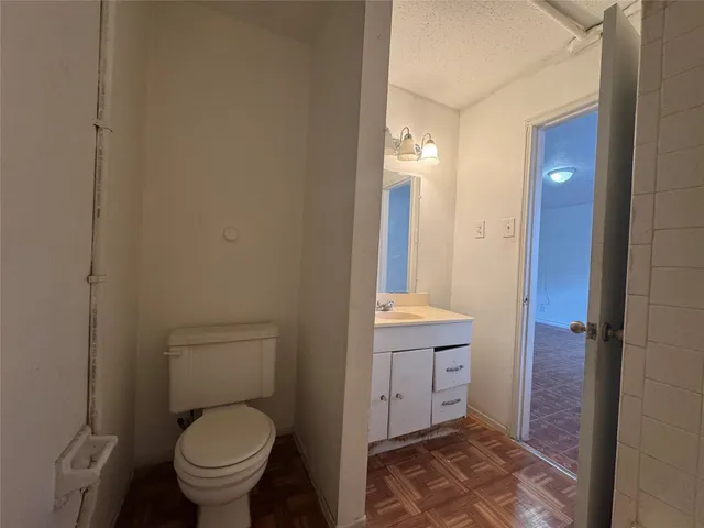 a bathroom with a toilet sink and shower