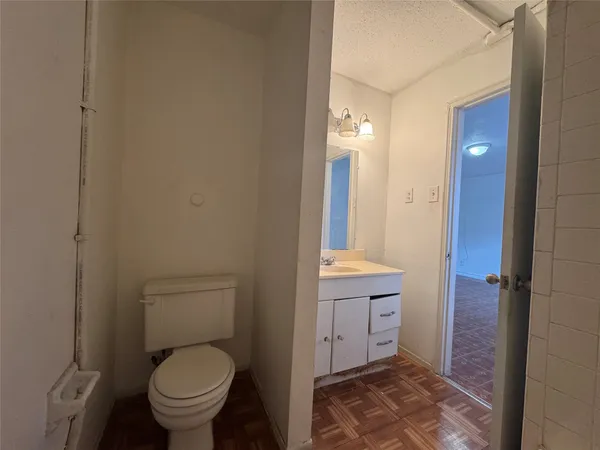 a bathroom with a toilet sink and shower