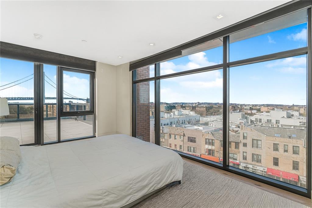401 95th Street, Unit 6A Brooklyn, NY 11209 - Photo 15 of 24 a large bedroom with a large window and a balcony