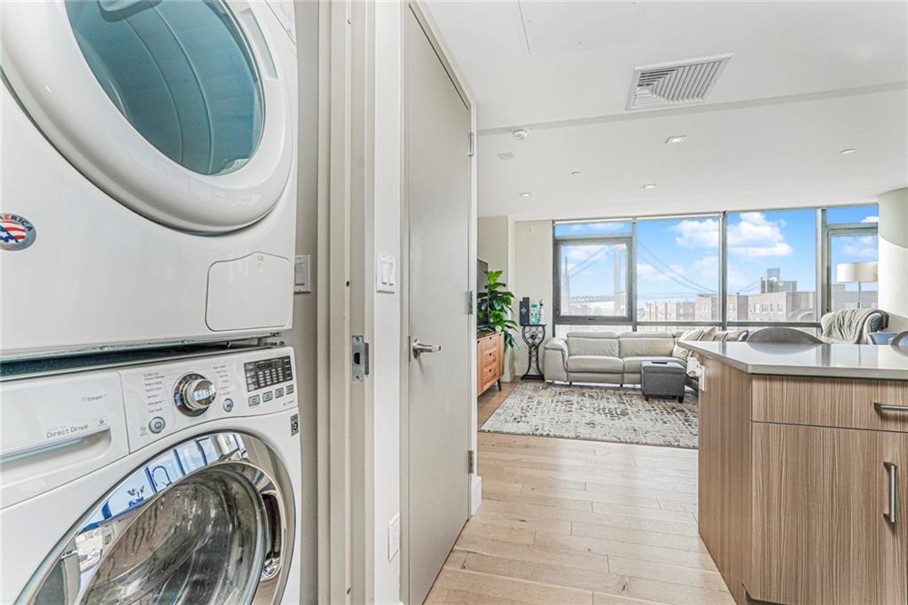 401 95th Street, Unit 6A Brooklyn, NY 11209 - Photo 5 of 24 a view of a kitchen with washer and dryer