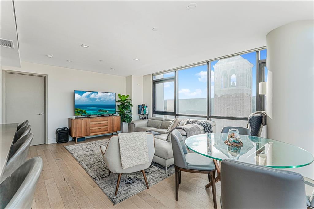 401 95th Street, Unit 6A Brooklyn, NY 11209 - Photo 6 of 24 a living room with furniture and a flat screen tv