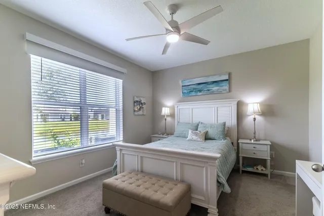 a bedroom with a bed and a table