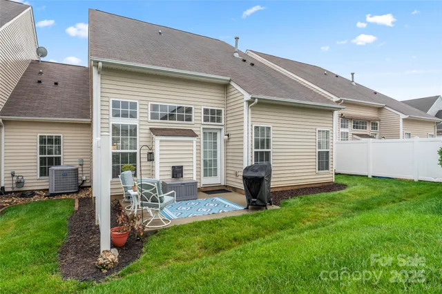 a front view of house with yard and outdoor seating