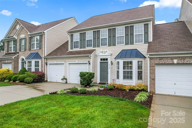a front view of a house with a yard and porch