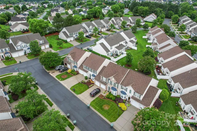 an aerial view of a house with a garden