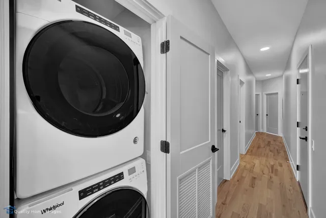 a view of a hallway with washer and dryer