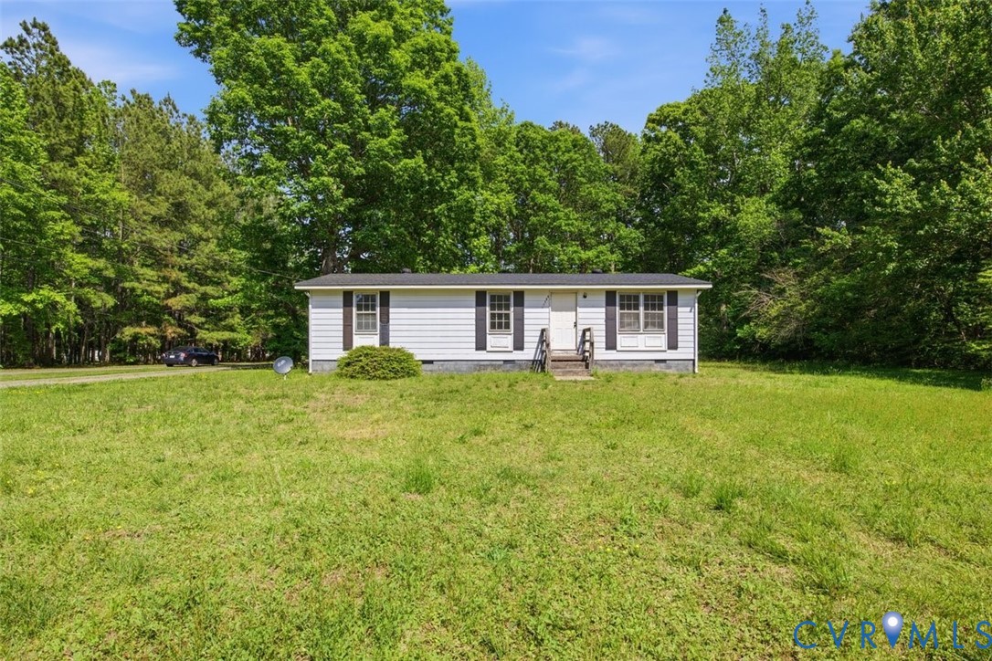 14527 Arwood Road Disputanta, VA 23842 - Photo 3 of 20 a front view of house with yard and green space