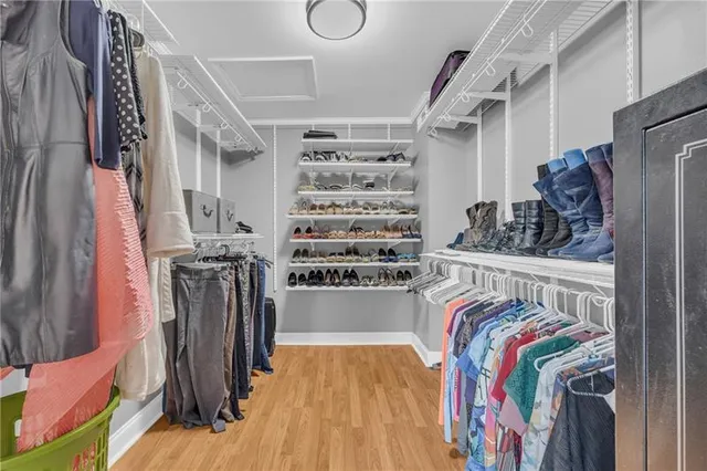 a bathroom with a double vanity sink mirror and toilet