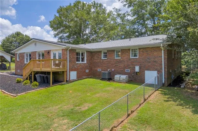 a bathroom with a shower and a sink