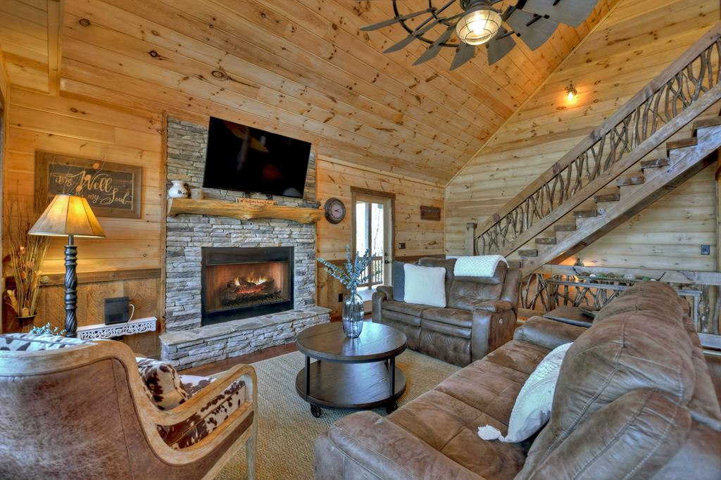 136 Oasis Drive Blue Ridge, GA 30513 - Photo 12 of 47 a living room with furniture and a fireplace