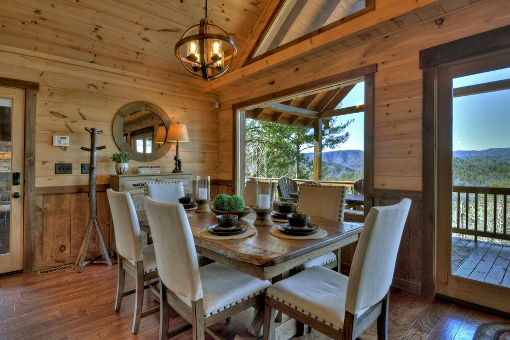 136 Oasis Drive Blue Ridge, GA 30513 - Photo 15 of 47 a view of a dining room with furniture window and wooden floor
