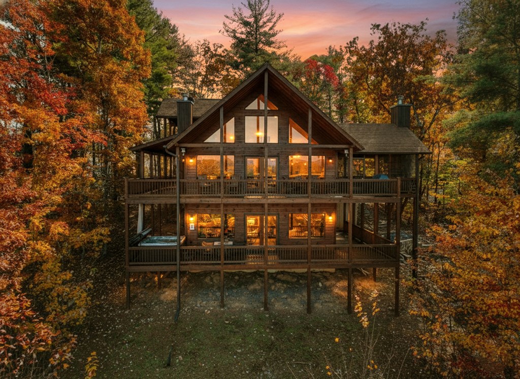 136 Oasis Drive Blue Ridge, GA 30513 - Photo 2 of 47 a view of a houses with lake