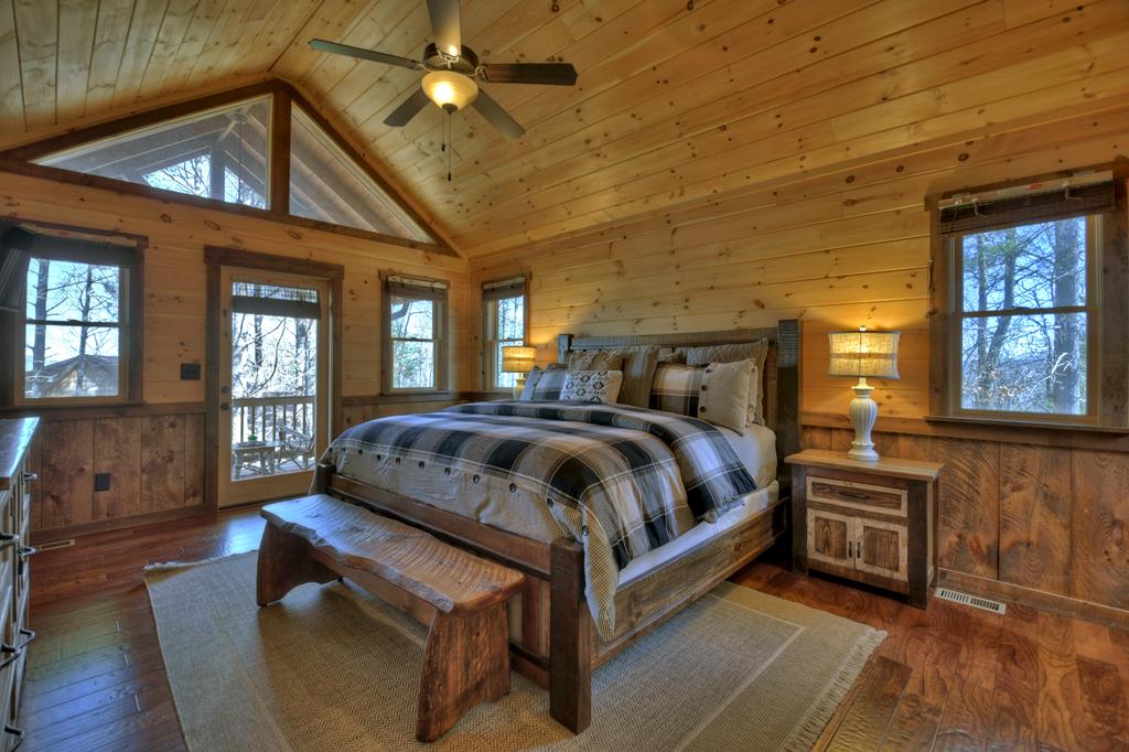 136 Oasis Drive Blue Ridge, GA 30513 - Photo 28 of 47 a bedroom with a bed and window