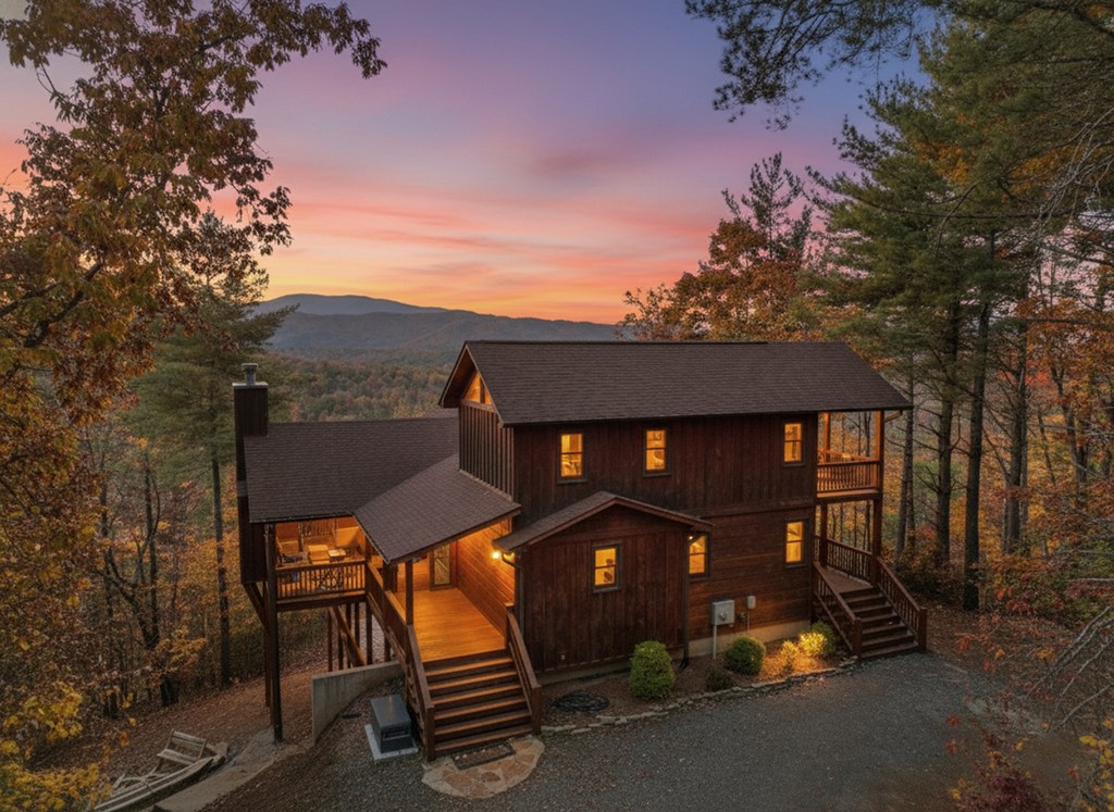 136 Oasis Drive Blue Ridge, GA 30513 - Photo 3 of 47 a front view of a house with parking