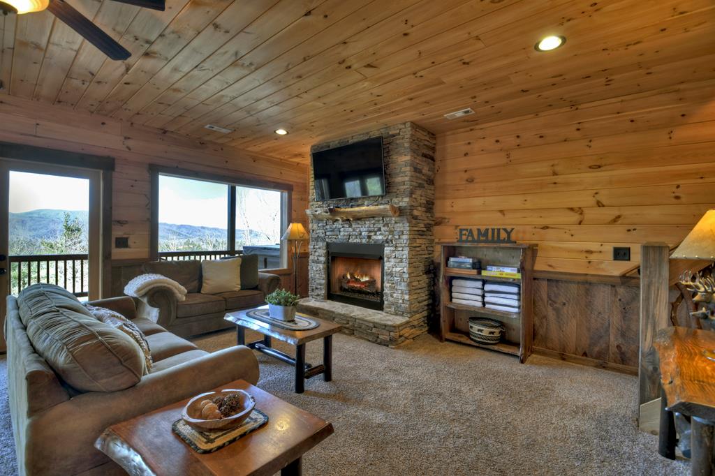 136 Oasis Drive Blue Ridge, GA 30513 - Photo 34 of 47 a living room with furniture and a fireplace