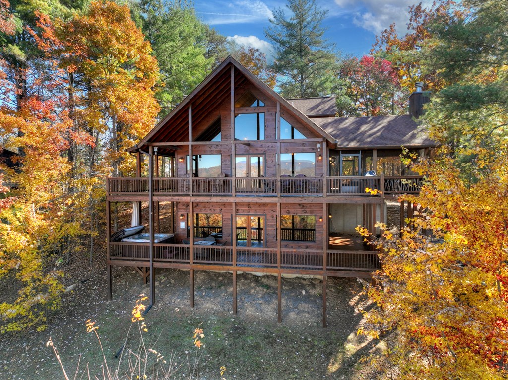 136 Oasis Drive Blue Ridge, GA 30513 - Photo 6 of 47 front view of a house with a small yard
