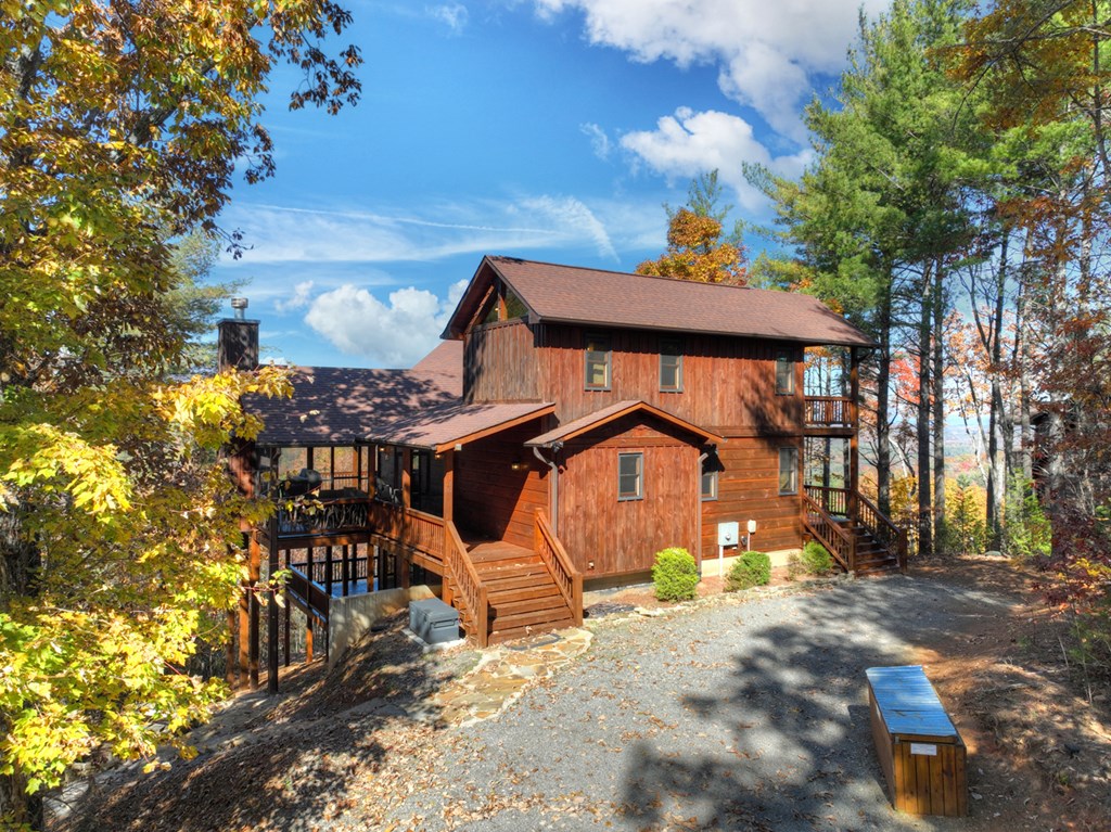 136 Oasis Drive Blue Ridge, GA 30513 - Photo 8 of 47 a front view of a house with a yard
