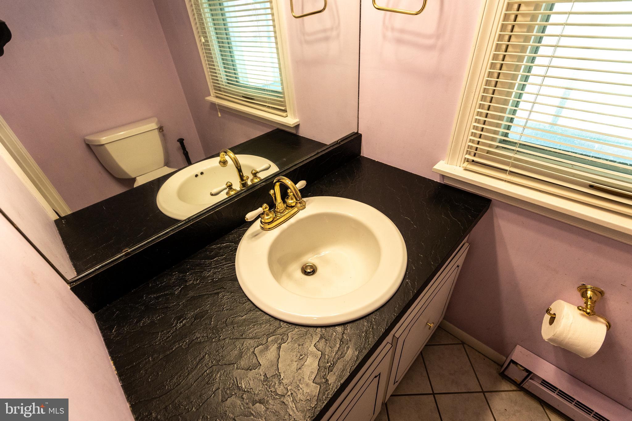 1929 Hillendale Road Chadds Ford, PA 19317 - Photo 30 of 56 a bathroom with a sink mirror vanity and toilet