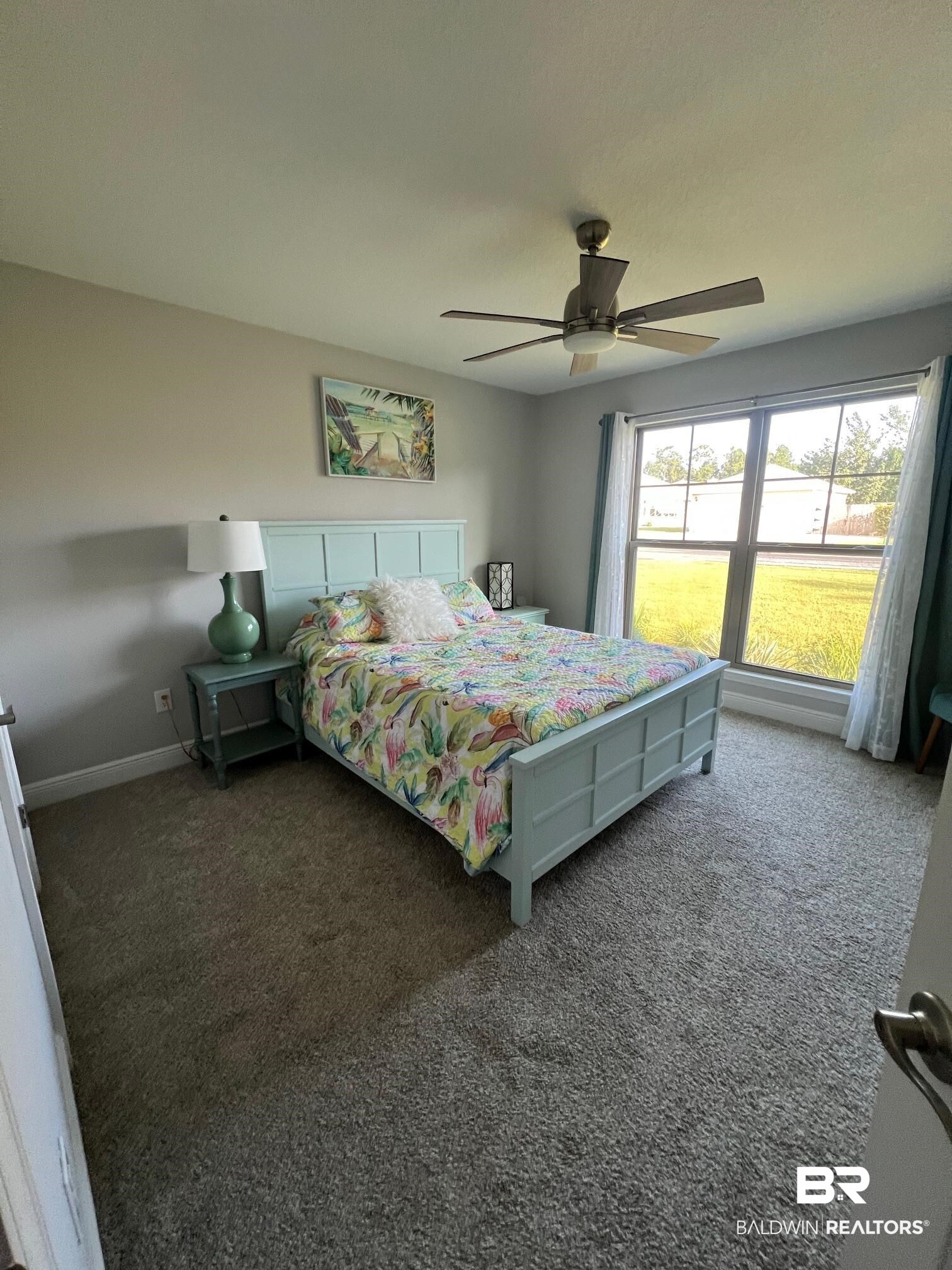 32915 Arbor Ridge Circle Lillian, AL 36549 - Photo 11 of 26 Carpeted bedroom featuring ceiling fan and baseboards