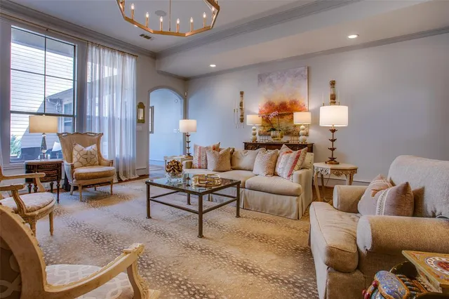 a living room with furniture and a lamp