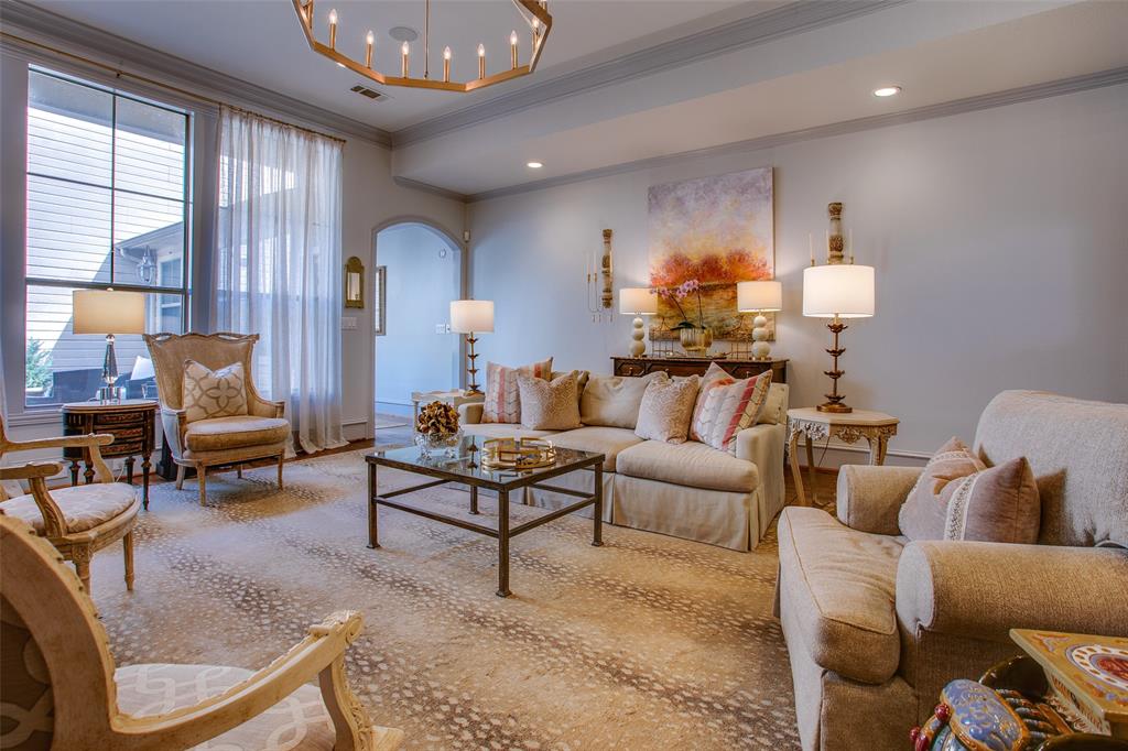 4139 Herschel Avenue Dallas, TX 75219 - Photo 16 of 30 a living room with furniture and a lamp