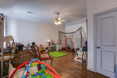 a living room with lots of furniture and a chandelier