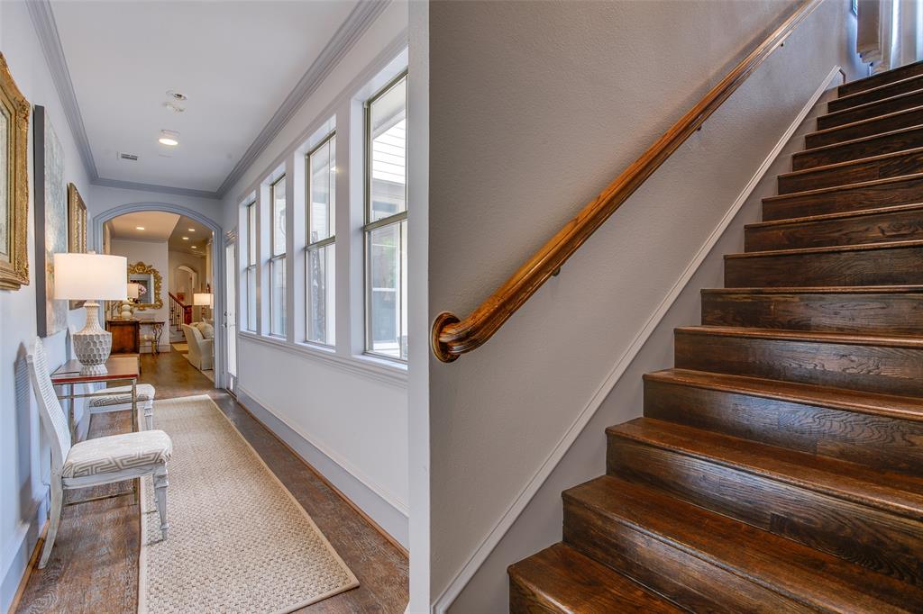 4139 Herschel Avenue Dallas, TX 75219 - Photo 27 of 30 a view of staircase with wooden floor and furniture