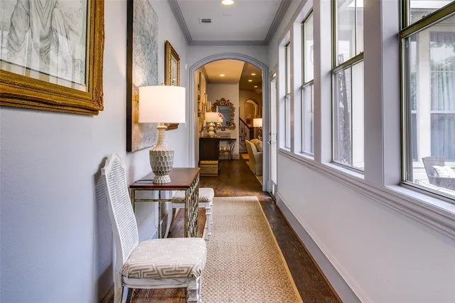 a view of a dining room with furniture and a window