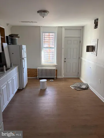 a room with furniture and a flat screen tv