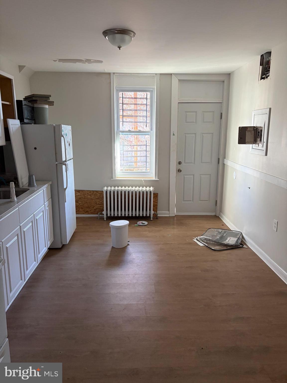 305 South Calhoun Street Baltimore, MD 21223 - Photo 5 of 13 a room with furniture and a flat screen tv