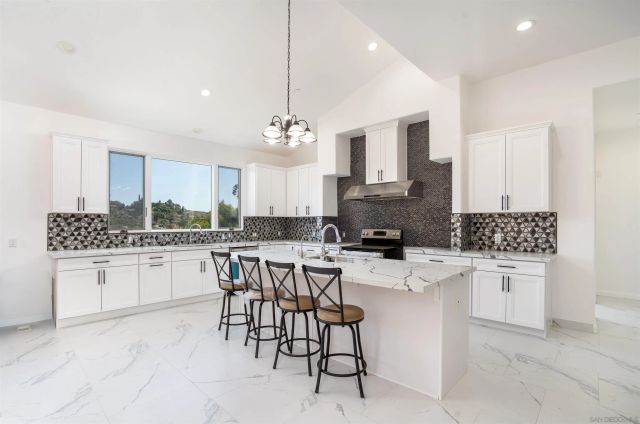 a view of empty room with window and fireplace