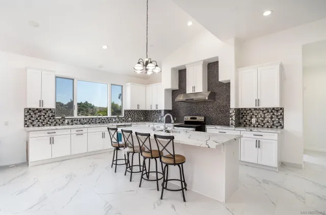 a view of empty room with window and fireplace