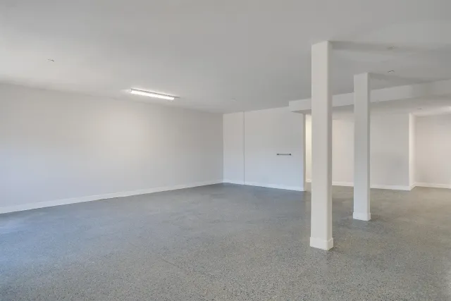 an aerial view of a house with a big yard